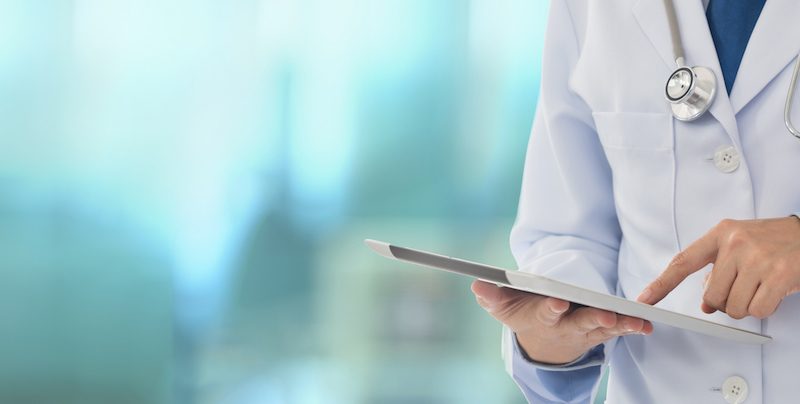 Doctor using digital tablet find information patient medical history at the hospital. Medical technology concept