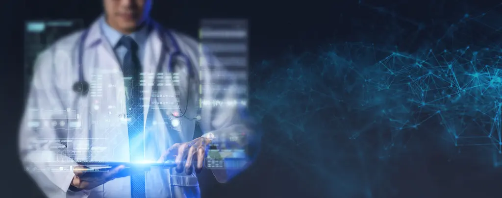 Doctor using computer and abstract graphics UI, modern medical health care and technology concept